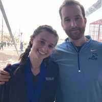 <p>Tess Stapleton, left, with Heads Up Running coach Justin Tomczyk, won two medals at nationals, in the long jump and high jump.</p>