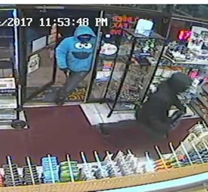 Two suspects enter the Rainbow News and Variety in Norwalk Saturday night.