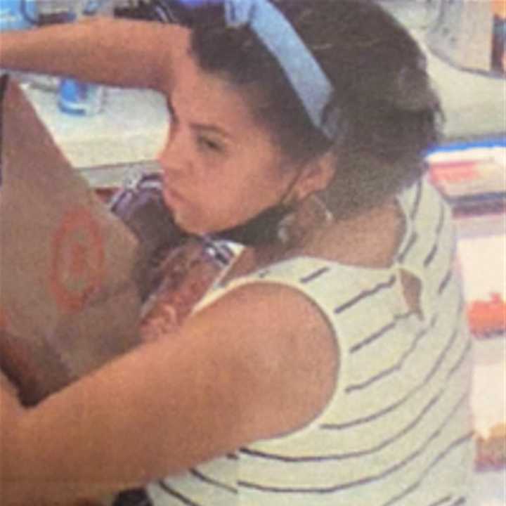 Police are asking the public for help identifying and locating a woman accused of stealing merchandise from a Target in Suffolk County.