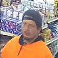 <p>Police are searching for a man accused of stealing an envelope containing $1,200 at a Long Island deli in April.</p>