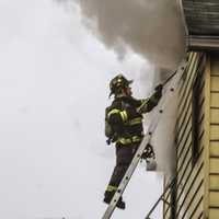 <p>Firefighters quickly converged on the Fair Street house.</p>