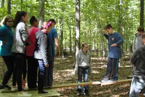 Irvington Seventh-Graders Work Together Through Obstacle Course Challenges 