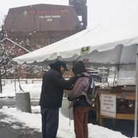 <p>A team member talks with a local resident in Newark.</p>