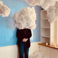 <p>Terri See, who also works as an artist, stands behind a piece of cloud art she created for the movie &quot;The Secret Art of Human Flight,&quot; which was released in June 2023.</p>