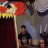 <p>Chris Arturi sits in the Funhouse Room, part of his haunted house in Stony Point, Thirty Knapp Road.</p>