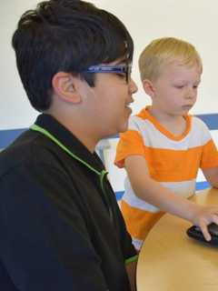 Fifth Graders At Todd Elementary Share Coding Skills With Kindergartners