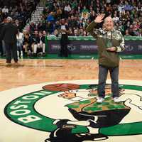 <p>Tom Costanzo waves to the group after receiving a &#x27;Heroes Among Us&#x27; award.</p>