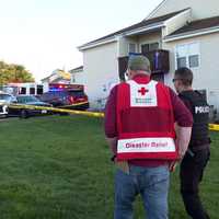 <p>Red Cross officials arrive to help residents.&nbsp;</p>