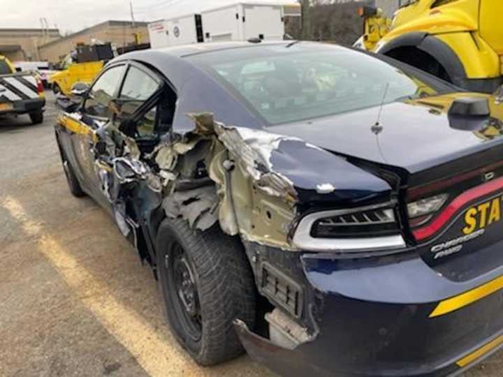 A parked New York State Police car was struck by a Freightliner box truck on Tuesday, Nov. 30.