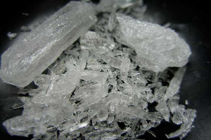 An alleged drug dealer from Queens is facing charges after police said he was busted with crystalized methamphetamine in Merrick.