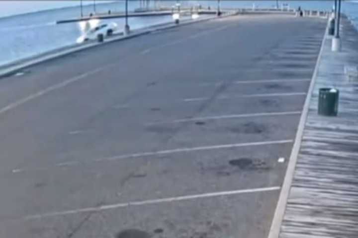 Surveillance footage of the moment a 33-year-old Patchogue man drove into Patchogue Bay Thursday morning, June 15.