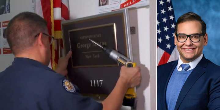 A Congressional employee removes the name plaque outside former New York Rep. George Santos' House office on Friday, Dec. 1.&nbsp;