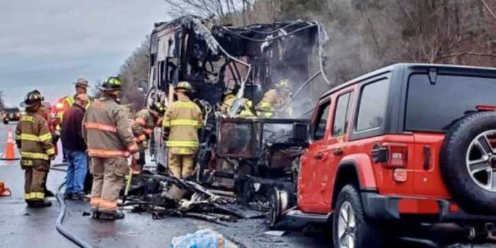 Firefighters inspect an RV that caught fire with two people inside on I-87 in Catskill on Thursday, Dec. 28.
  
