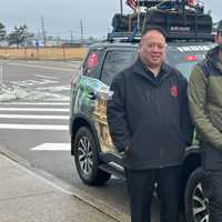 <p>Sinan Mohammad with members of the Suffolk County Police Department on Wednesday, Feb. 28.&nbsp;</p>