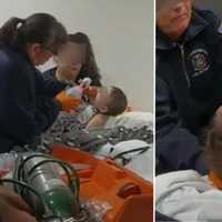 <p>Medics attend to an 11-month-old boy after a suspected fentanyl poisoning at a Lake Grove residence on Jan. 13.&nbsp;</p>