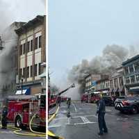 <p>Firefighters battle the blaze on South Main Street (US Route 1) in Port Chester.</p>