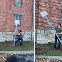 <p>New Putnam County Executive Kevin Byrne helps remove a VIP parking sign from the county office&#x27;s parking lot.</p>