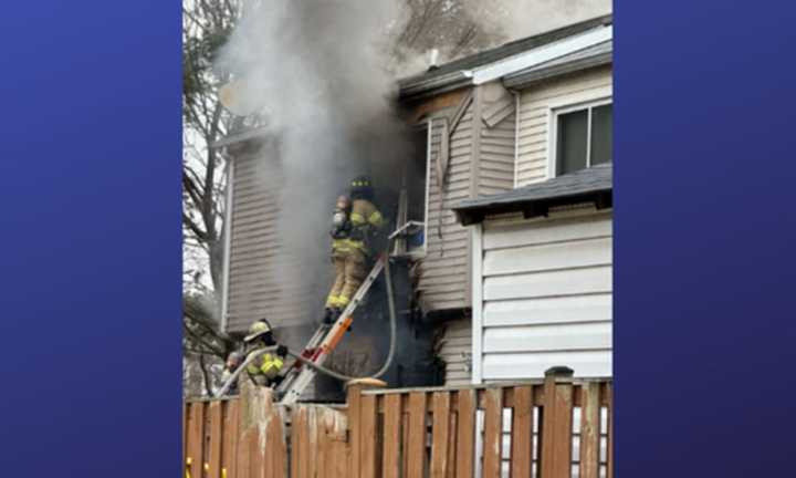 Firefighters work to control flames in the Landover home