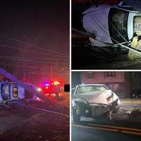 Pole Comes Crashing Down On Rolled-Over Car In Vernon