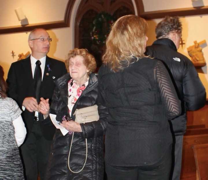 Attendees including his father, Ron (left), honored Cliffside Park Police Officer Stephen Petruzzello.