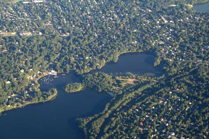 Divers pulled the body of a 17-year-old boy from Upper Mystic Lakes on Saturday, July 15, after he drowned while swimming with friends, police said.