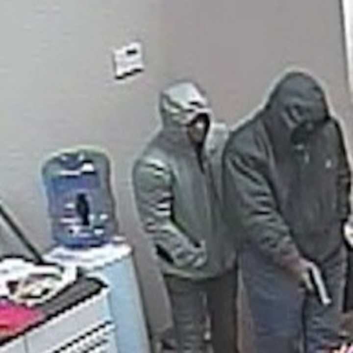 Police are seeking two men who are accused of stealing $20,000 worth of smart phones and iPads from a local Verizon store.