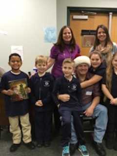 NAVES Captain Reads 'The Night Before Christmas' To Local Kids