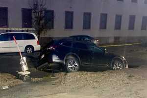 Sinkhole Swallows Subaru SUV After Water Main Bursts In Boston: Report