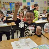 <p>As part of the experiments, the students watched an egg get sucked into a jar, lifted ice cubes with a string, played with tornado tubes and made a cloud in the classroom.</p>