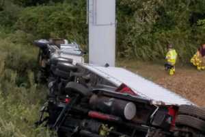 Two Tractor-Trailers Go Down Embankment Off I-95