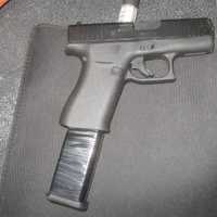 <p>Springfield police said officers found this loaded pistol with an extended magazine in William Hill&#x27;s car on July 19.</p>