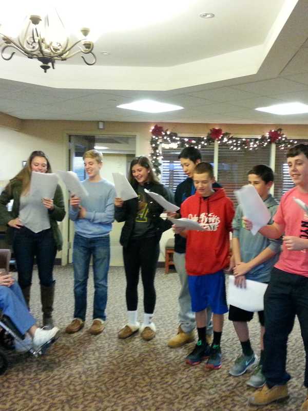 Yorktown High School Students Bring Holiday Music To Field Home
