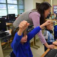 <p>Jessie Yu  puts third-graders through their paces at the Dows Lane Elementary School in Irvington during the district's recent "Hour of Code" event.</p>