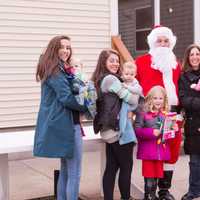 <p>Santa poses with Maureen LaPenta, third from right, her five children and two unidentified women.</p>