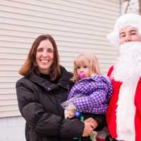 <p>Maureen LaPenta poses with one of her daughters and Santa at her home in Blauvelt. Her husband, Joe, is stationed overseas in Kuwait and won&#x27;t be home for the holidays.</p>