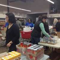 <p>Volunteers at Hillside Food Outreach helped pack over 1000 bags of food for homebound families in Westchester.</p>