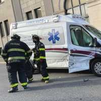 <p>Passaic firefighters popped a door to get the EMTs out.</p>