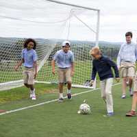 <p>Boys play soccer while enjoying time out of the classroom during the opening week at Ridgefield Academy.</p>