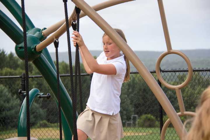 Emma Hayes-Setterlund of Wilton enjoys the outdoors at Ridgefield Academy, which returned to class last week.