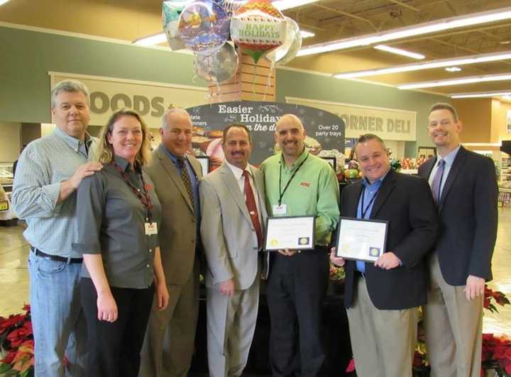 (L-R) Food Pantry Representative Chris Winnie, Acme Bakery Operations Specialist Danielle Ivanicki, Mayor Robert White, Community Partnership Coordinator Howard Weinberg, Eugene Pate, Michael Styer and Pastor of First Reformed Church Christoper Wolf.