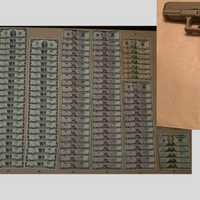 <p>The $2 bills and gun that were recovered from&nbsp;Hani Abdelmohsen Ahmed.</p>