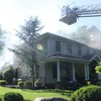 <p>Two ladder trucks were among the apparatus used to douse the Allendale fire.</p>