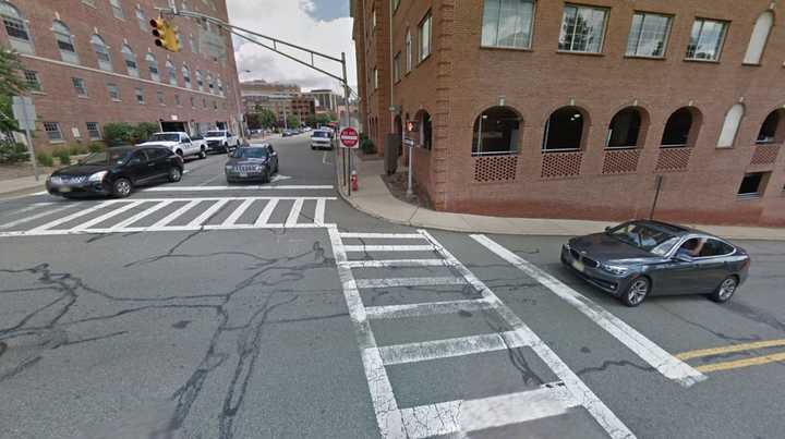 The victim was crossing Ann Street (right) when she was struck by the SUV, which was turning left off Schuyler Place.