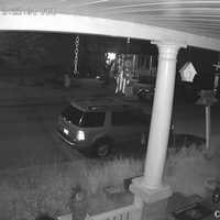 <p>Alleged arsonist walking in front sidewalk of the home at 41 North Walnut Street.</p>