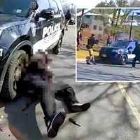 <p>Atiba Lewis rushes police (inset) and drops the knife and water bottle after he&#x27;s shot outside an apartment complex in Plainsboro in February 2022.</p>