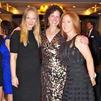 <p>AFEE President Anne Kay (center) at the organization&#x27;s 20th annual Auction and Dinner.</p>