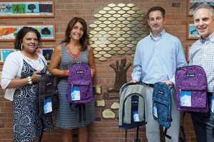 Stamford Board Of Realtors Donates Backpacks To 2 Elementary Schools