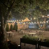 <p>The “backyard” dining area at Foster in Sea Cliff.</p>