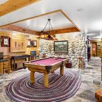 <p>The first floor features a billiard room, a full wet bar, and a state-of-the-art kitchen, which makes it ideal for hosting guests.&nbsp;</p>