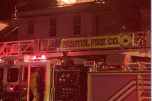 Three-Story Fire Ravages Residential Building